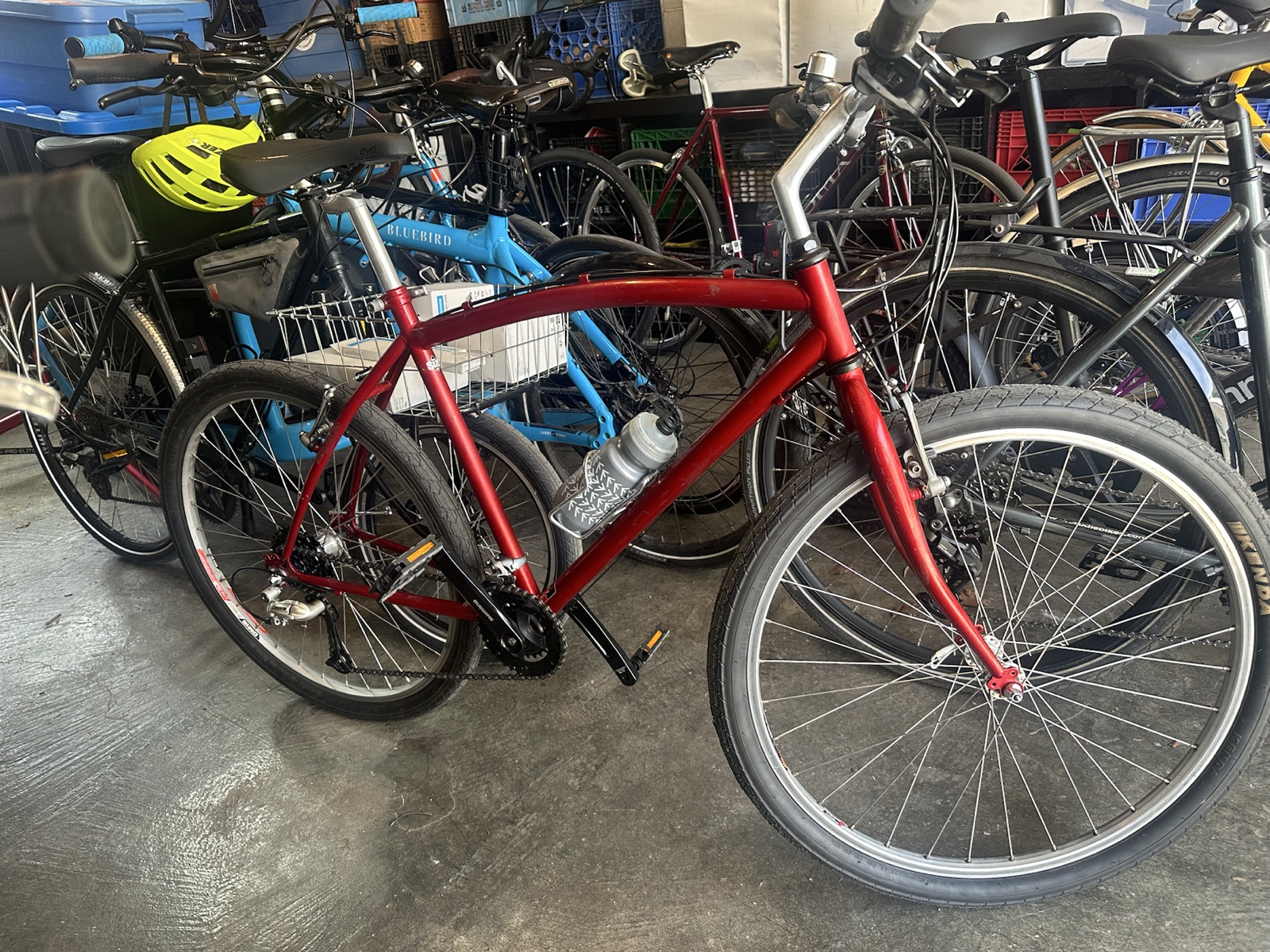 A red hand-built bicycle in Matthew's workshop